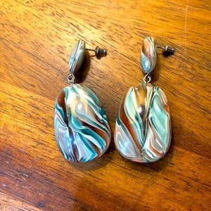 Machete brand drop earrings. Teal, brown, and white calico colored